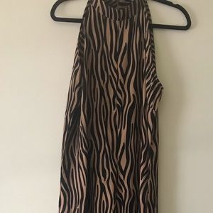 Never been worn brand new animal print sleeveless jumpsuit.